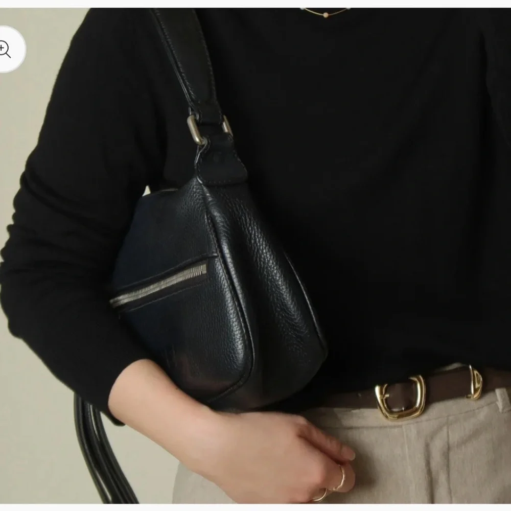 Authentic CHANEL black grained calfskin CC oversized charm baguette hobo bag